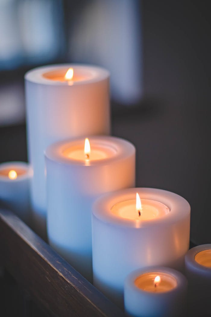 our-services-1 A close-up of a serene candlelight arrangement with a soft, soothing glow.